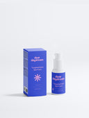 Front view of Dear Daydream Targeted Dark Spot Care with 1% Kojic Acid, 15 ml, white pump bottle with matching cobalt carton and pink sunshine icon.